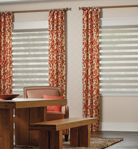 Window treatments complete with orange floral drapes Photo