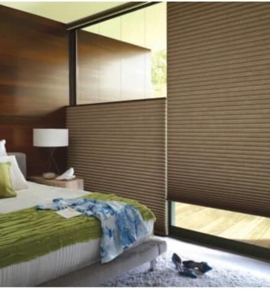Brown honeycomb shades in bedroom Photo