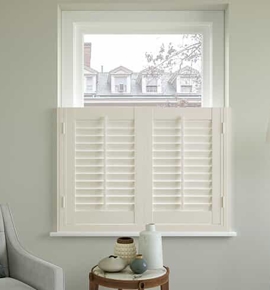 White Shutters by chair and lamp Photo